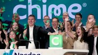 CEO of Chime, Chris Britt, center right, rings the opening bell during the company’s initial public offering at the Nasdaq MarketSite on June 12, 2025 in New York City.
